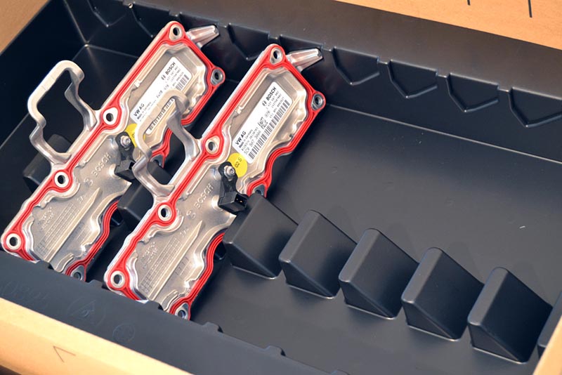 Komplettlösungen aus Kunststoff, Einlage in Karton